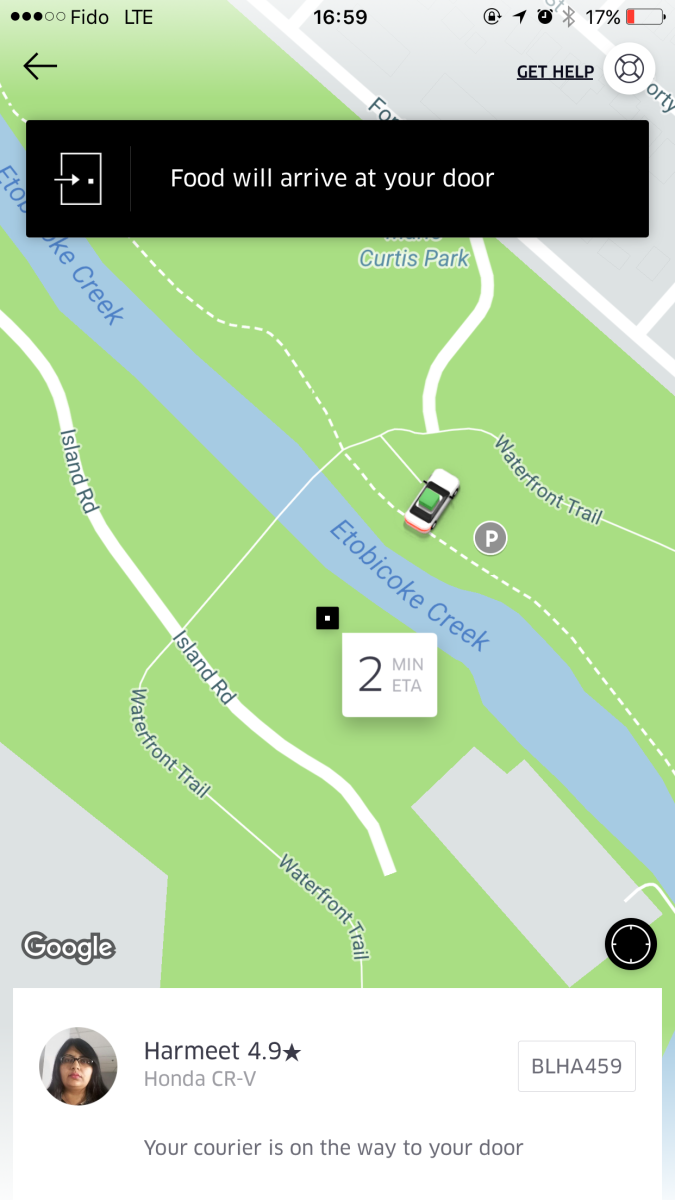 Screen grab of UberEats car parked.